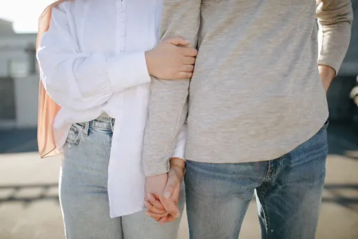 A close up view of a couple holding hands an - Marriage & Relationships