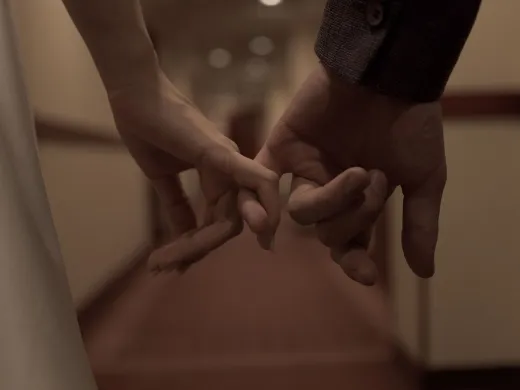 Tender close up of two hands holding each ot - Marriage & Relationships