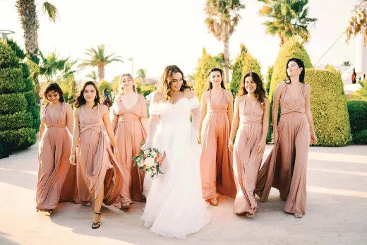 Bride and bridesmaids walking together happi - Weddings (General)