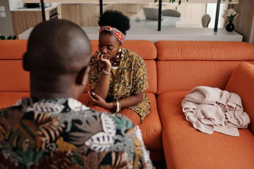 A thoughtful couple engaged in a deep discus - Marriage & Relationships