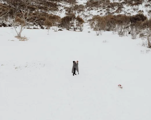 A romantic couple embracing in a snowy lands - Weddings (General)
