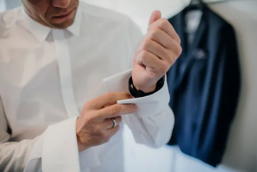Close up of a man adjusting his cufflinks sh - Wedding Fashion & Jewellery