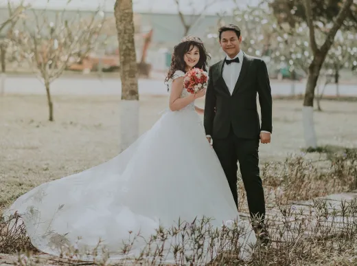 Happy bride and groom in a park during a joy - Marriage & Relationships