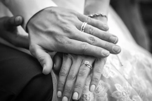 Close up of a couple s hands with wedding ri - Wedding Fashion & Jewellery