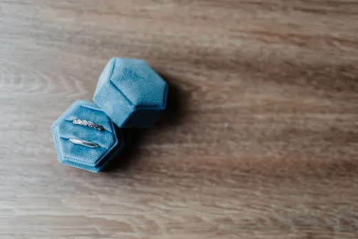 Close up of rings in a blue velvet box on a - Wedding Fashion & Jewellery