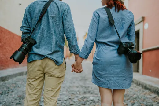 Back view of a couple holding hands each wit - Marriage & Relationships