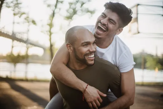 Happy interracial gay couple enjoying a play - Marriage & Relationships