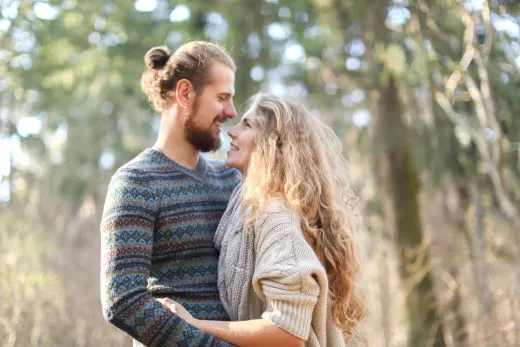 Couple in knitwear sharing affectionate gaze - Marriage & Relationships