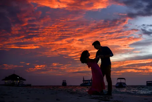 Silhouetted couple sharing a romantic moment - Marriage & Relationships