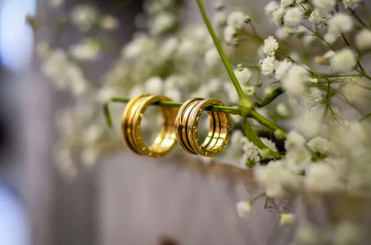 Close up of shimmering gold wedding bands de - Wedding Fashion & Jewellery