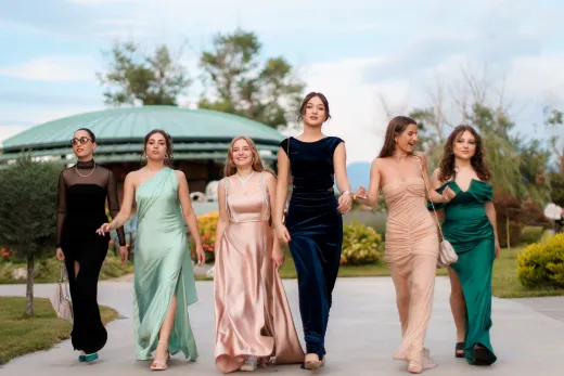 A group of six women in elegant evening dres - Wedding Fashion & Jewellery