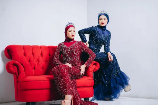 Two women in elegant hijabs and gowns with c - Wedding Fashion & Jewellery