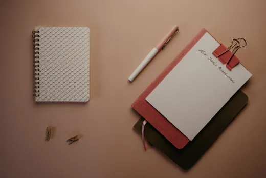 Organized flatlay of notebooks and pen for p - Wedding Planning & Budget