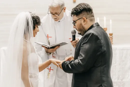 Bride and groom exchanging vows in a church - Weddings (General)